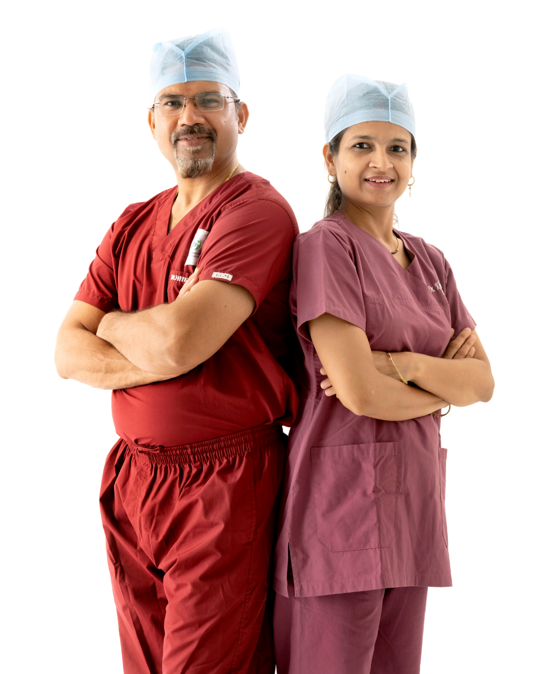 Dr. Hitesh Mangal and Dr. Khushboo Jain standing back to back in surgical scrubs